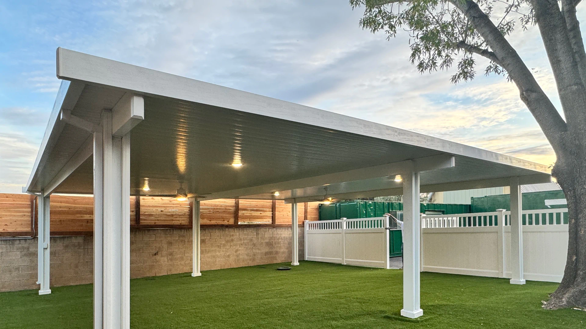 large white pergola on top of artificial turf 2