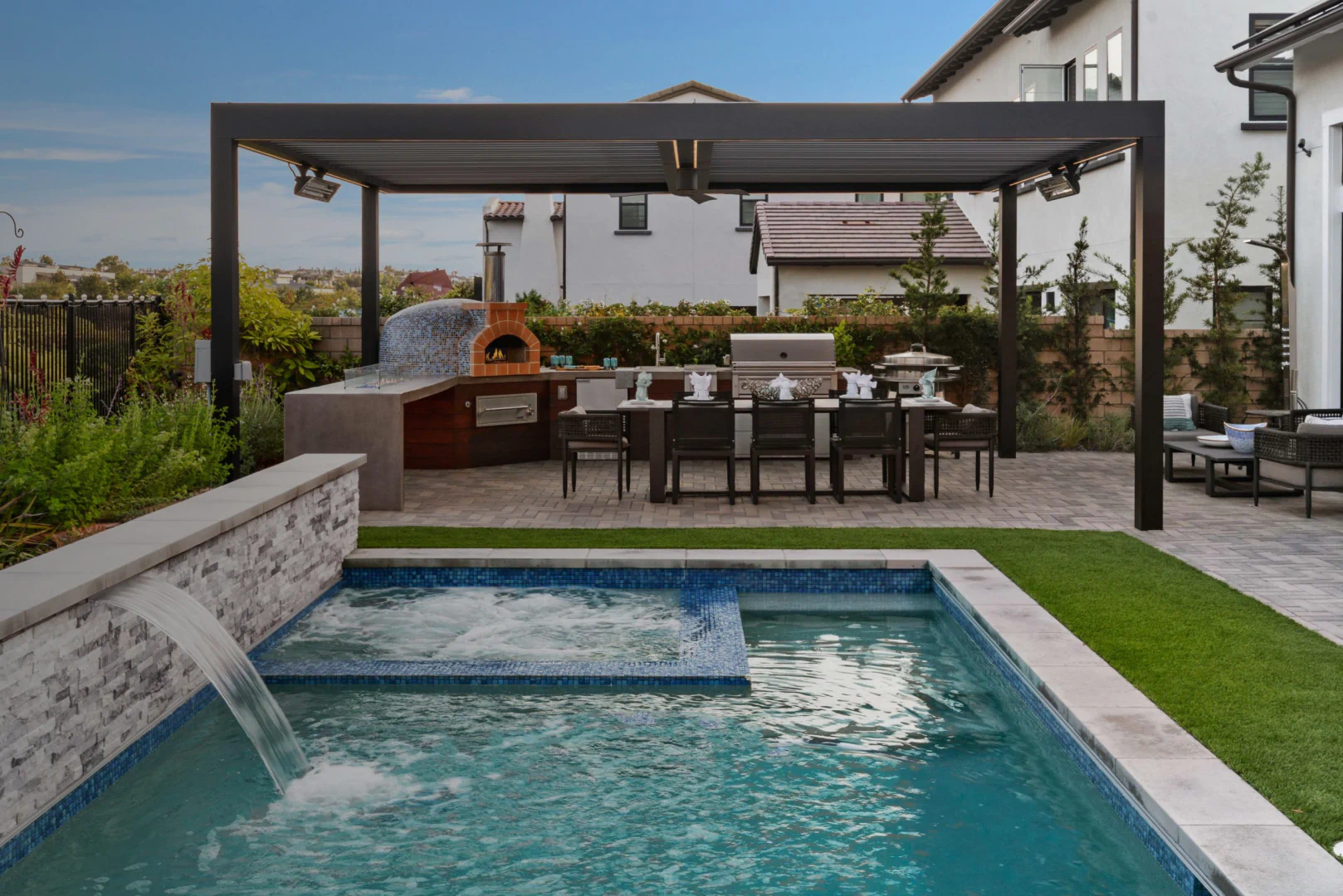 hero exterior patio and outdoor kitchen beside pool